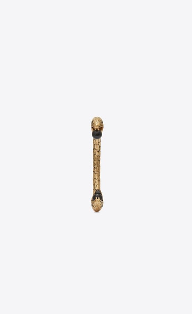 Snake bracelet in gold metal with black glass beads.